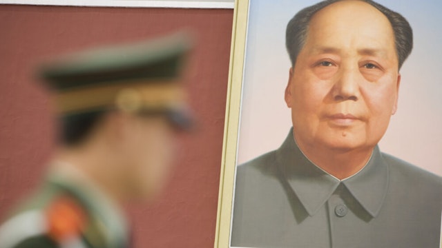 China, Beijing, Forbidden City, policeman and painting of Mao Tse Tung