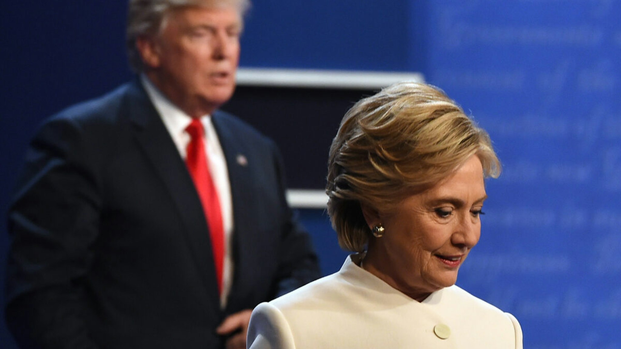 Democratic nominee Hillary Clinton (R) and Republican nominee Donald Trump walk off the stage after the final presidential debate at the Thomas & Mack Center on the campus of the University of Las Vegas in Las Vegas, Nevada on October 19, 2016.