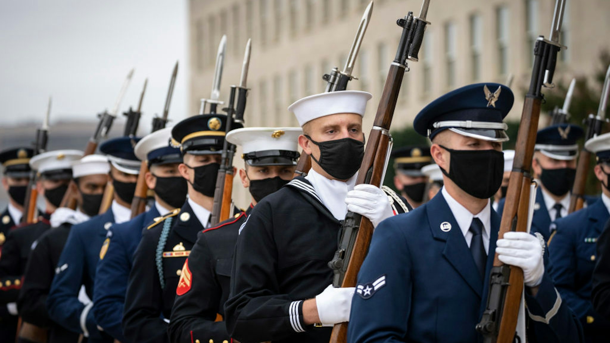 ARLINGTON, VA - OCTOBER 06: A military honor guard arrives for a welcome ceremony for Polish Defense Minister Mariusz Blaszczak at the Pentagon October 6, 2021 in Arlington, Virginia. Blaszczak has served as Polish Defense Minister since early 2018. (Photo by Drew Angerer/Getty Images)