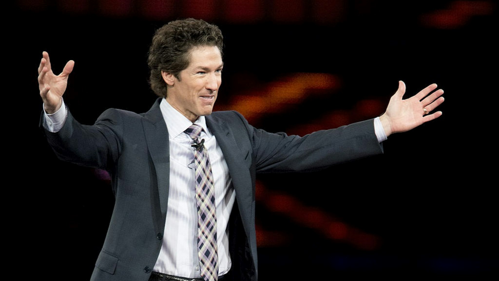 DALLAS, TX - AUGUST 30: Pastor Joel Osteen speaks during MegaFest at the American Airlines Center on August 30, 2013 in Dallas, Texas.