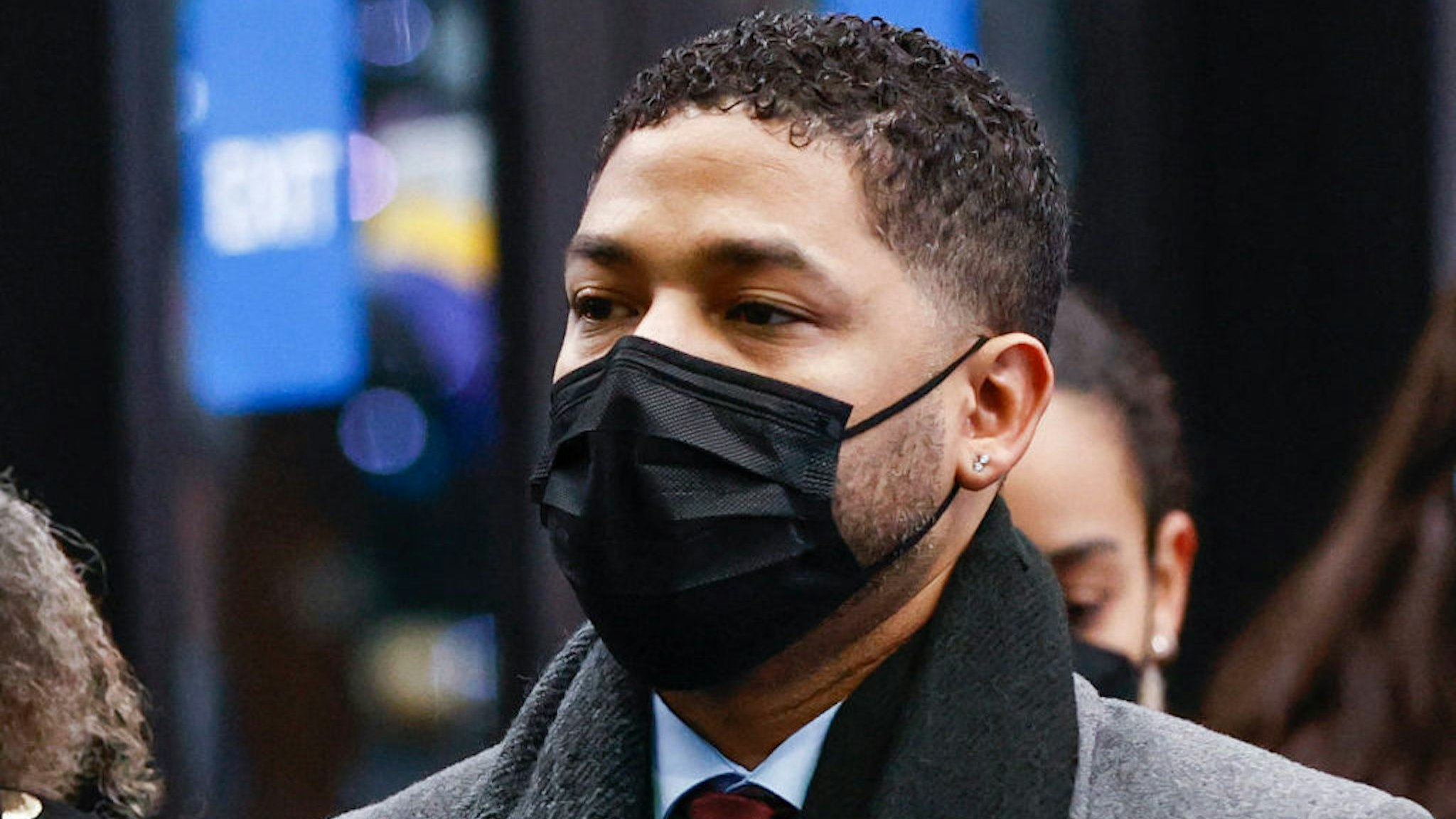 Jussie Smollett arrives with family members at the Leighton Criminal Court Building for his trial on disorderly conduct charges on December 6 2021 in Chicago, Illinois. - Former "Empire" star Jussie Smollett is accused of making false reports to authorities that he was the victim of a racist and homophobic attack in 2019. (Photo by KAMIL KRZACZYNSKI / AFP) (Photo by KAMIL KRZACZYNSKI/AFP via Getty Images)