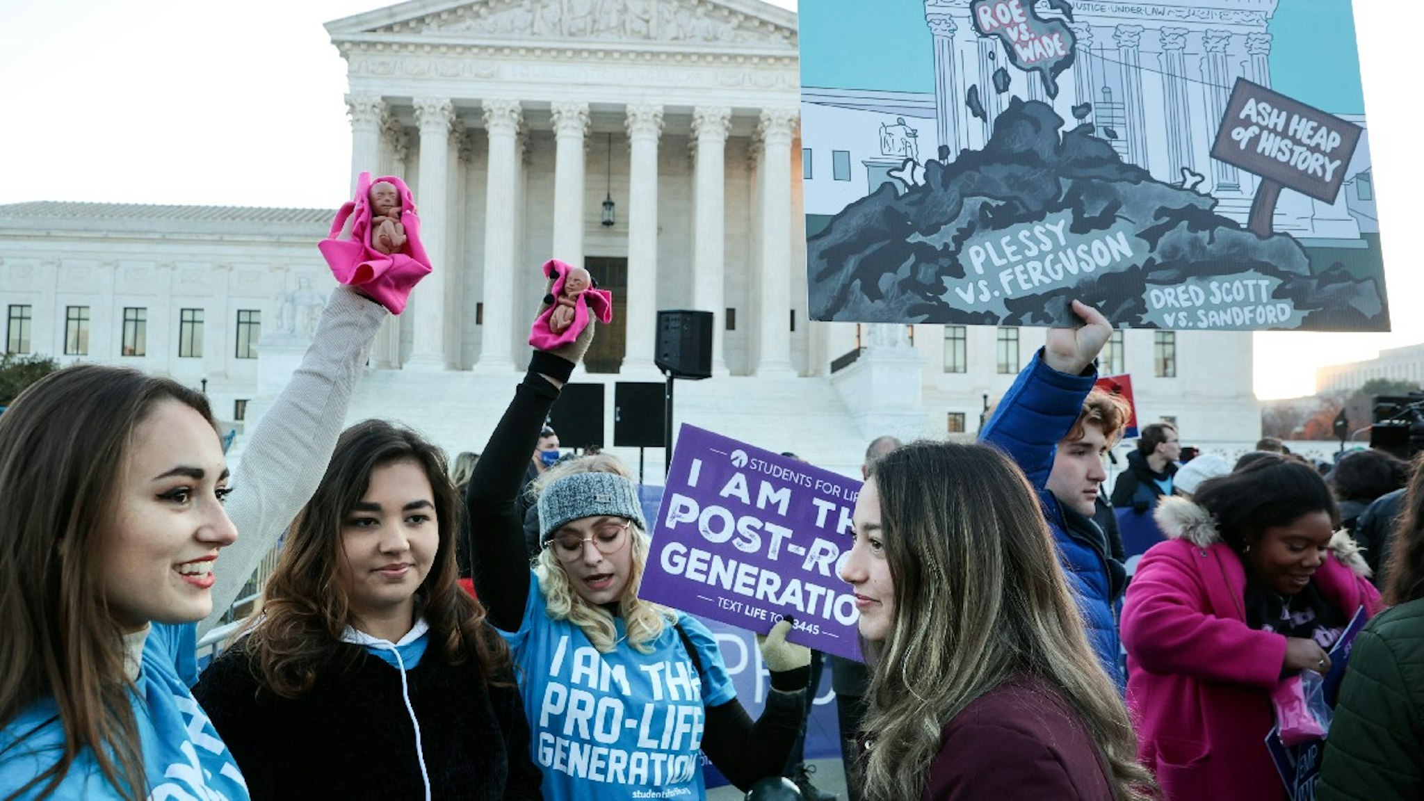 rotesters, demonstrators and activists gather in front of the U.S. Supreme Court as the justices hear arguments in Dobbs v. Jackson Women's Health, a case about a Mississippi law that bans most abortions after 15 weeks, on December 01, 2021 in Washington, DC.