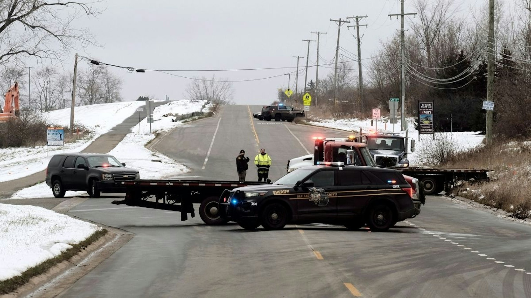 A police road block restricts access to Oxford High School following a shooting on November 30, 2021 in Oxford, Michigan.