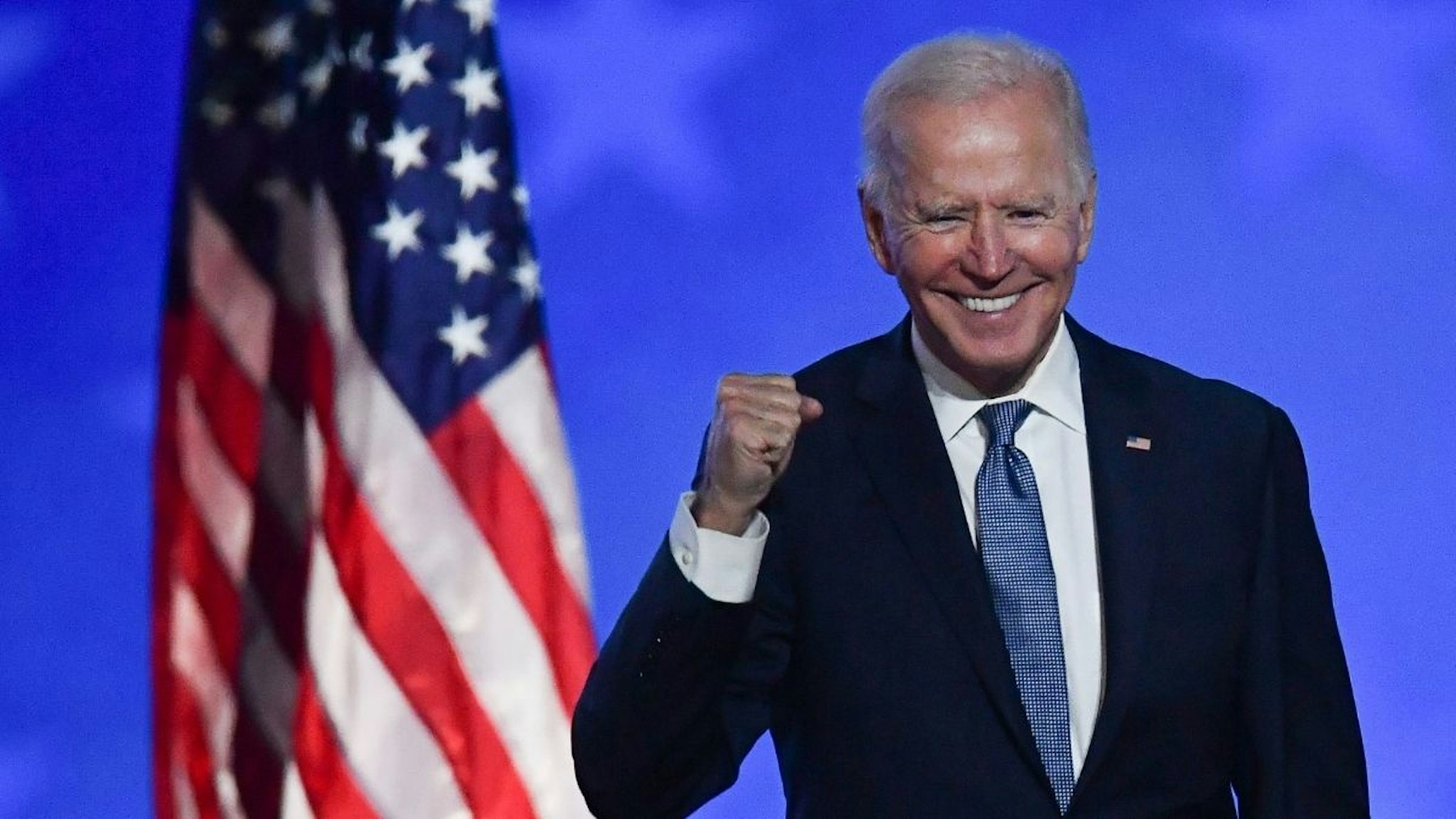 Then-Democratic presidential nominee Joe Biden gestures after speaking during election night at the Chase Center in Wilmington, Delaware, early on November 4, 2020.