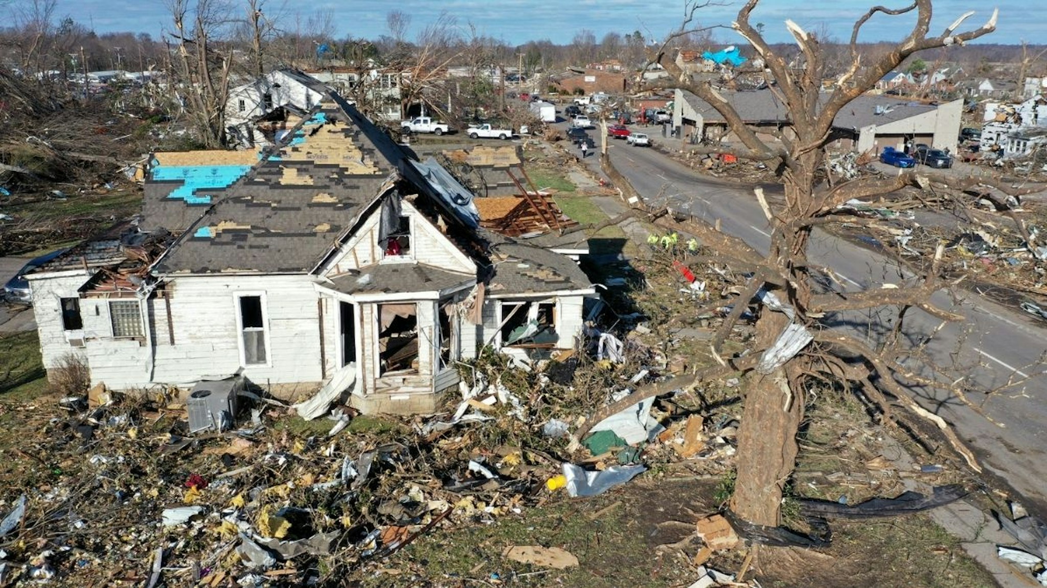In this aerial view, homes are badly destroyed after a tornado ripped through area the previous evening on December 11, 2021 in Mayfield, Kentucky.