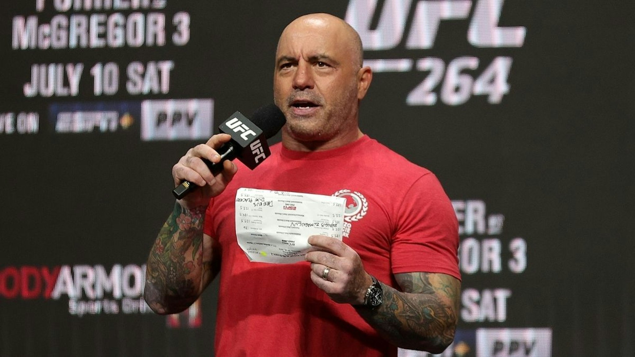 UFC commentator Joe Rogan announces the fighters during a ceremonial weigh in for UFC 264 at T-Mobile Arena on July 09, 2021 in Las Vegas, Nevada.