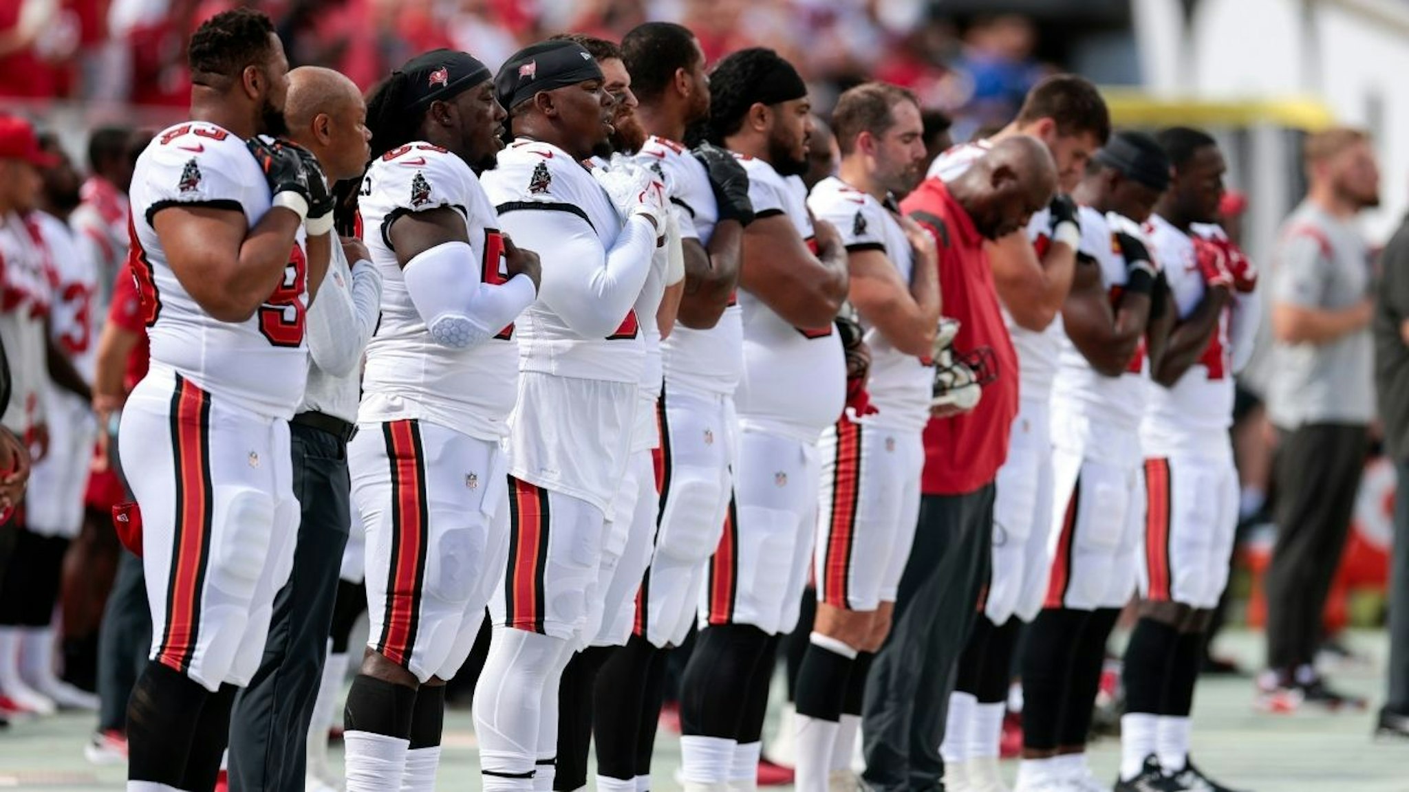 Rakeem Nunez-Roches #56 of the Tampa Bay Buccaneers stands with other players during the National Anthem prior to the game against the Atlanta Falcons at Raymond James Stadium on September 19, 2021 in Tampa, Florida.