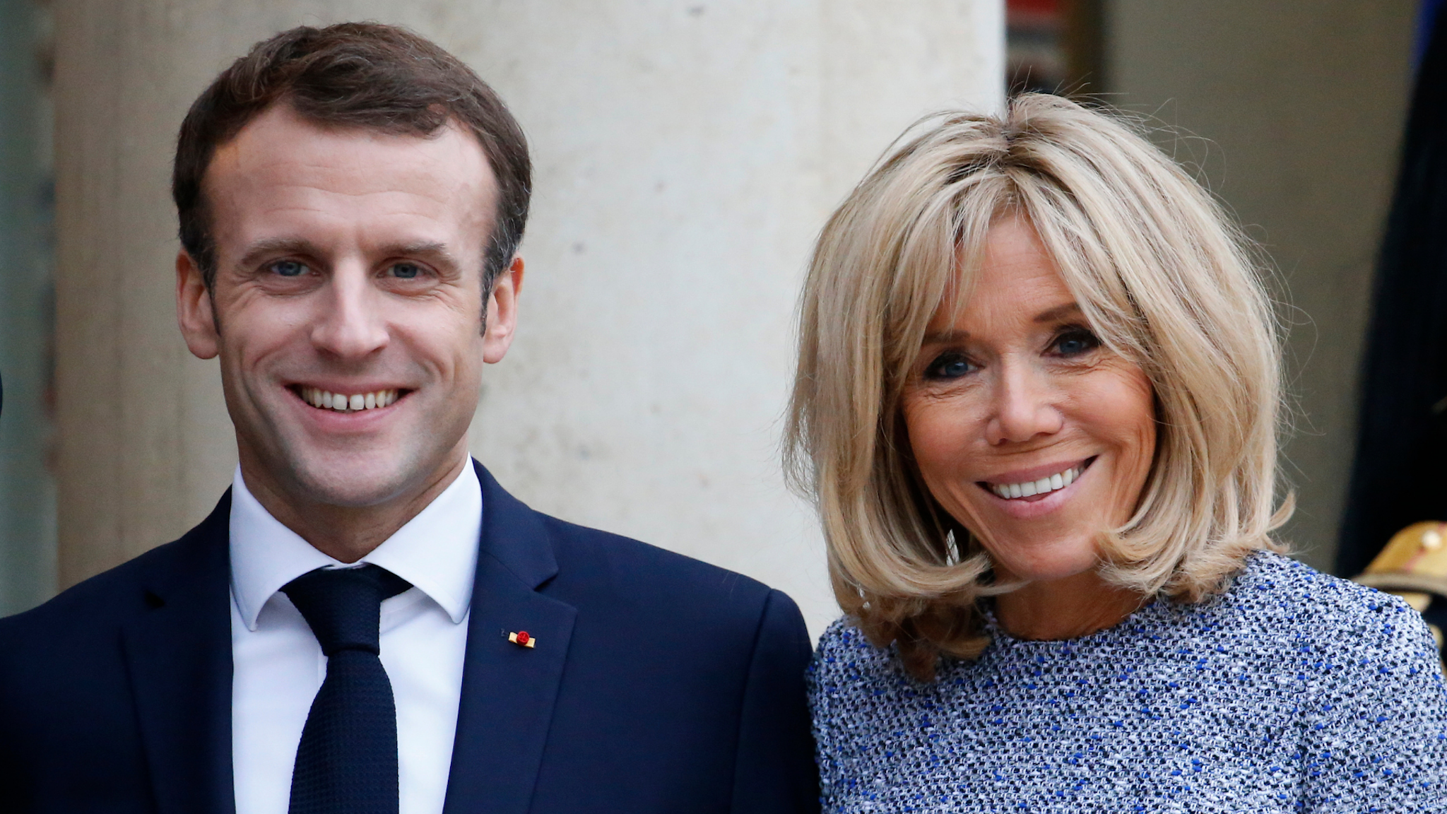 French President Emmanuel Macron and his wife Brigitte Macron accompany Romanian President Klaus Iohannis and his Carmen Iohannis (not seen) after their meeting at the Elysee Presidential Palace on November, 27 2018, in Paris, France.