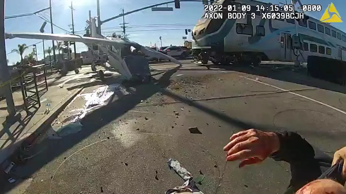 L.A. Police Pull Pilot Out Of Plane Stuck On Railroad Tracks Right As Train Hits It