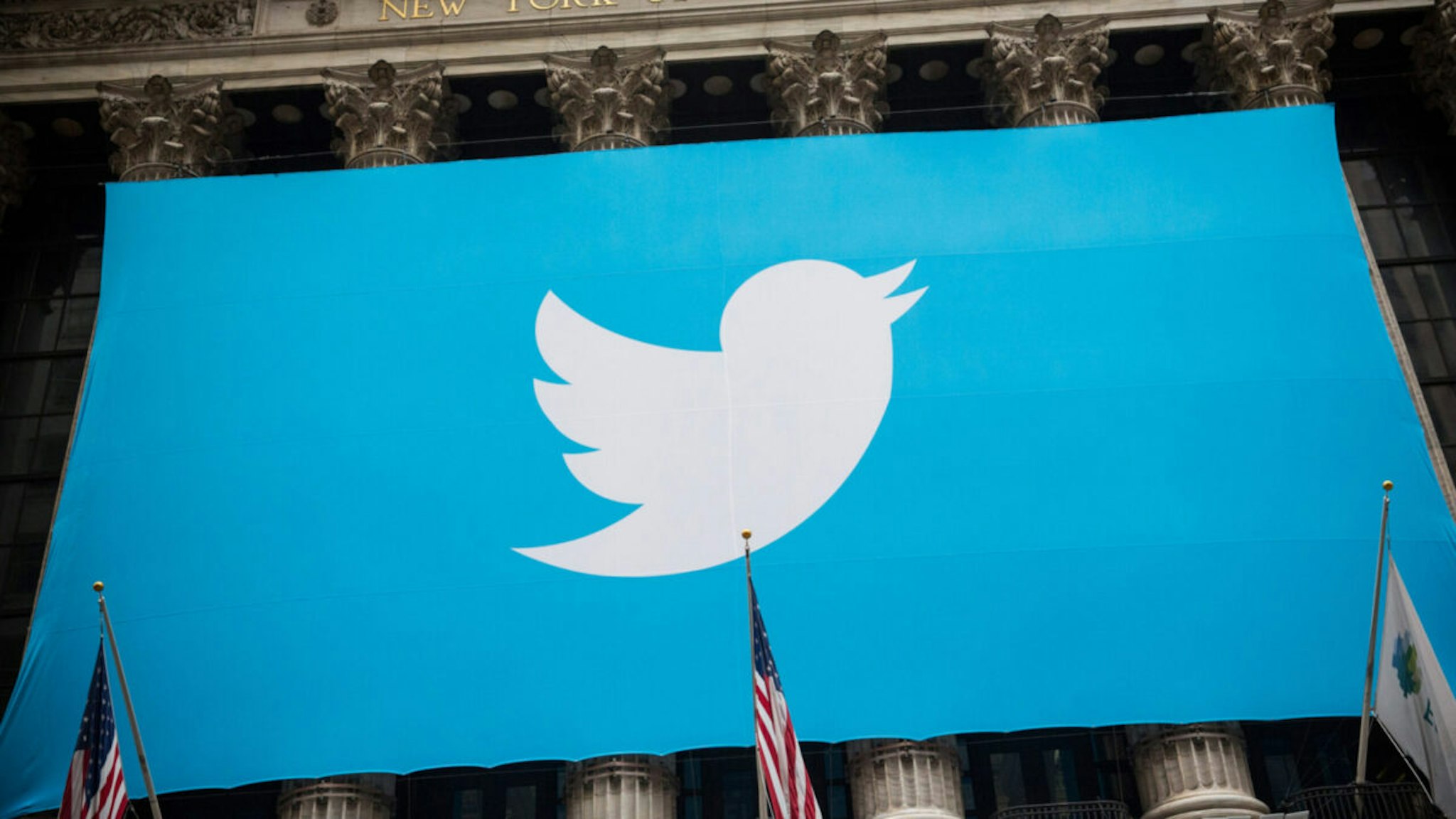 The Twitter logo is displayed on a banner outside the New York Stock Exchange (NYSE) on November 7, 2013 in New York City.