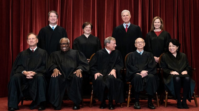 Members of the Supreme Court pose for a group photo at the Supreme Court in Washington, DC on April 23, 2021.