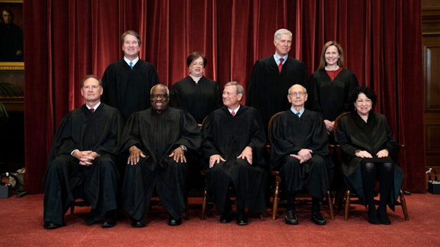 Members of the Supreme Court pose for a group photo at the Supreme Court in Washington, DC on April 23, 2021.