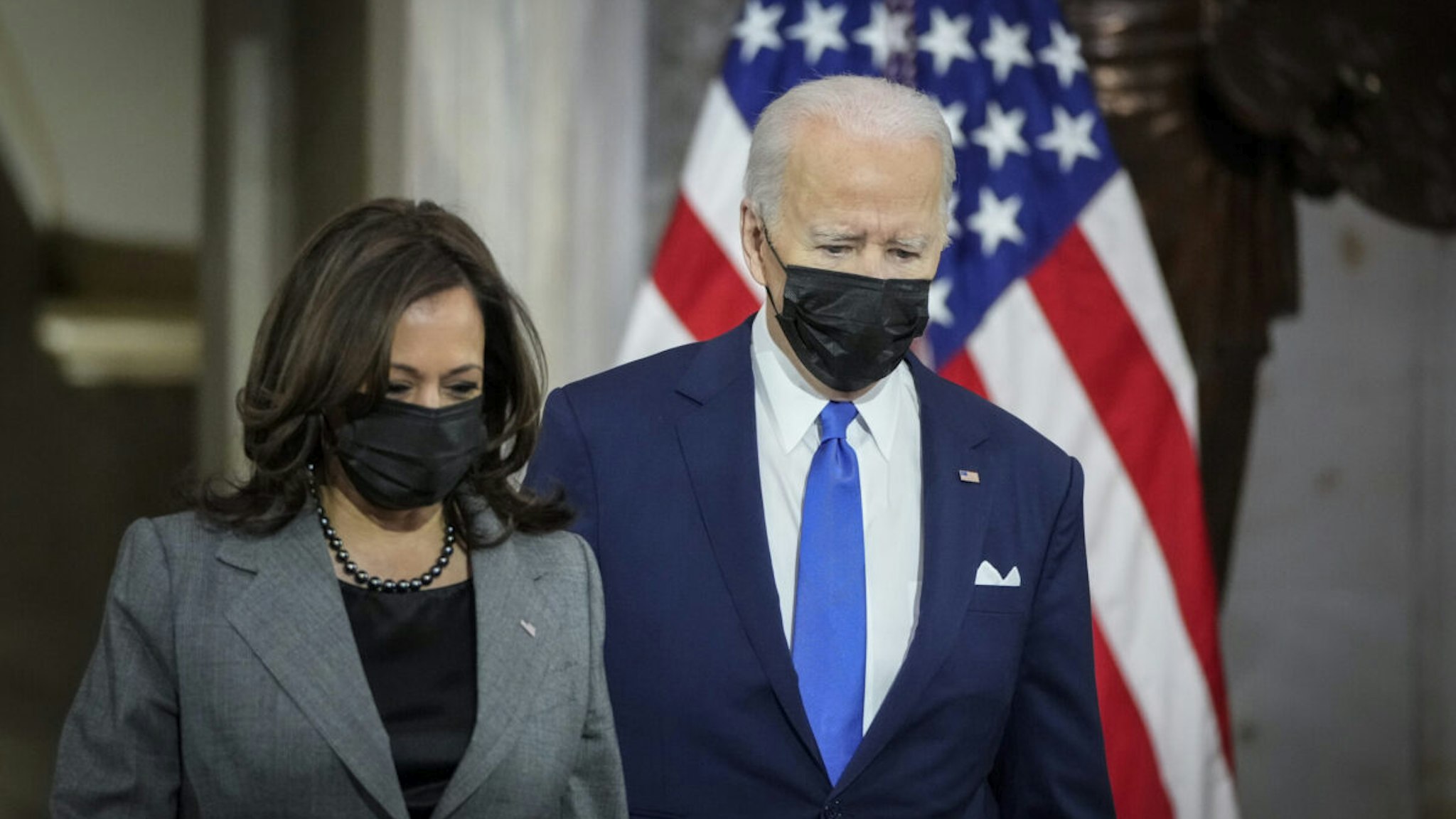 President Joe Biden and Vice President Kamala Harris arrive to deliver remarks on the one year anniversary of the January 6 attack on the U.S. Capitol, during a ceremony in Statuary Hall at the U.S. Capitol on January 06, 2022 in Washington, DC.