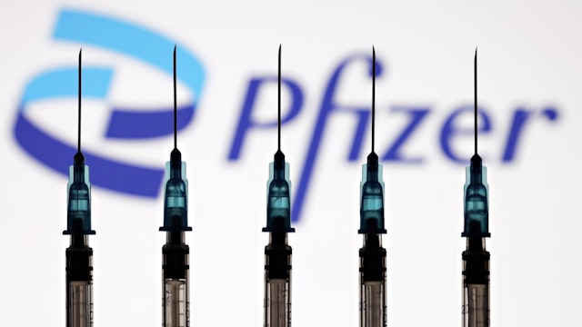 Pfizer BioNTech Announce Covid-19 Vaccine Candidate NEW YORK, NEW YORK - OCTOBER 03: In this photo illustration, a medical syringe and vials of the Pfizer US pharmaceutical corporation and BioNTech German biotechnology 2021 company logos are seen on October 03, 2021 in New York City. Pfizer and BioNTech announced its conclude phase 3 study of COVID-19 vaccine candidate with 95% primary efficacy analysis, as the media reported on 18 November 2020. (Photo Illustration by Cindy Ord/Getty Images for Pfizer/BioNTech) Cindy Ord / Staff