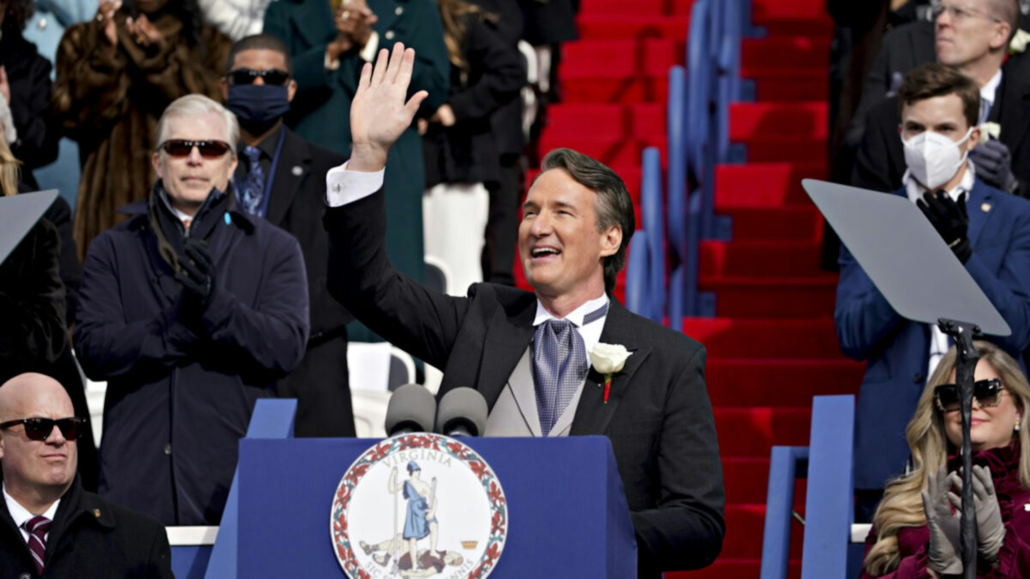 Glenn Youngkin, governor of Virginia, waves while speaking after being sworn in during an inauguration ceremony at Capitol Square in Richmond, Virginia, U.S., on Saturday, Jan. 15, 2022.