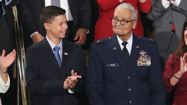 WASHINGTON, DC - FEBRUARY 04: Retired U.S. Air Force Col. Charles McGee, who served with the Tuskagee Airmen, attends the State of the Union address with his great- grandson Iain Lanphier in the chamber of the U.S. House of Representatives on February 04, 2020 in Washington, DC. President Trump delivers his third State of the Union to the nation the night before the U.S. Senate is set to vote in his impeachment trial.