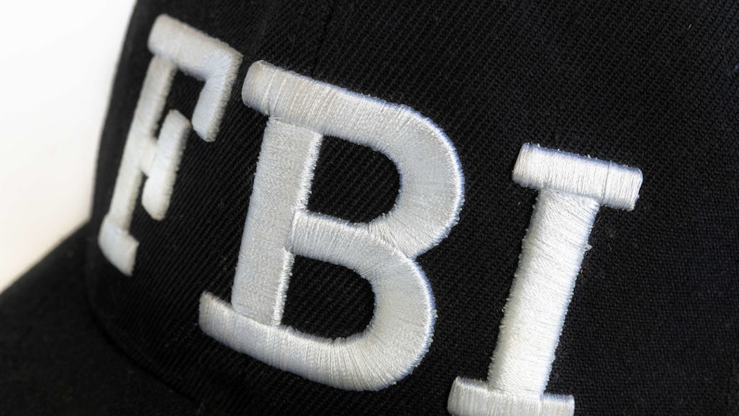 TORONTO, ONTARIO, CANADA - 2019/02/21: Close up of the FBI logo on a black cap. The text stands for Federal Bureau of Investigations.
