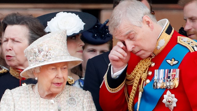LONDON, UNITED KINGDOM - JUNE 08: (EMBARGOED FOR PUBLICATION IN UK NEWSPAPERS UNTIL 24 HOURS AFTER CREATE DATE AND TIME) Queen Elizabeth II and Prince Andrew, Duke of York watch a flypast from the balcony of Buckingham Palace during Trooping The Colour, the Queen's annual birthday parade, on June 8, 2019 in London, England. The annual ceremony involving over 1400 guardsmen and cavalry, is believed to have first been performed during the reign of King Charles II. The parade marks the official birthday of the Sovereign, although the Queen's actual birthday is on April 21st.