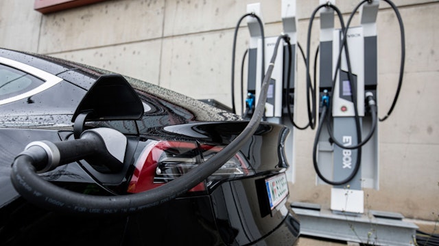 A charging plug sits inserted into a Tesla Inc. electric vehicle at an experimental charging point installation at the Verbund AG combined cycle gas turbine power plant in Mellach, Austria, on Thursday, June 25, 2020.