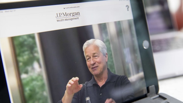 Jamie Dimon, chief executive officer of JPMorgan Chase & Co., speaks virtually during a webcast event on a tablet computer in Tiskilwa, Illinois, U.S., on Wednesday, April 21, 2021.