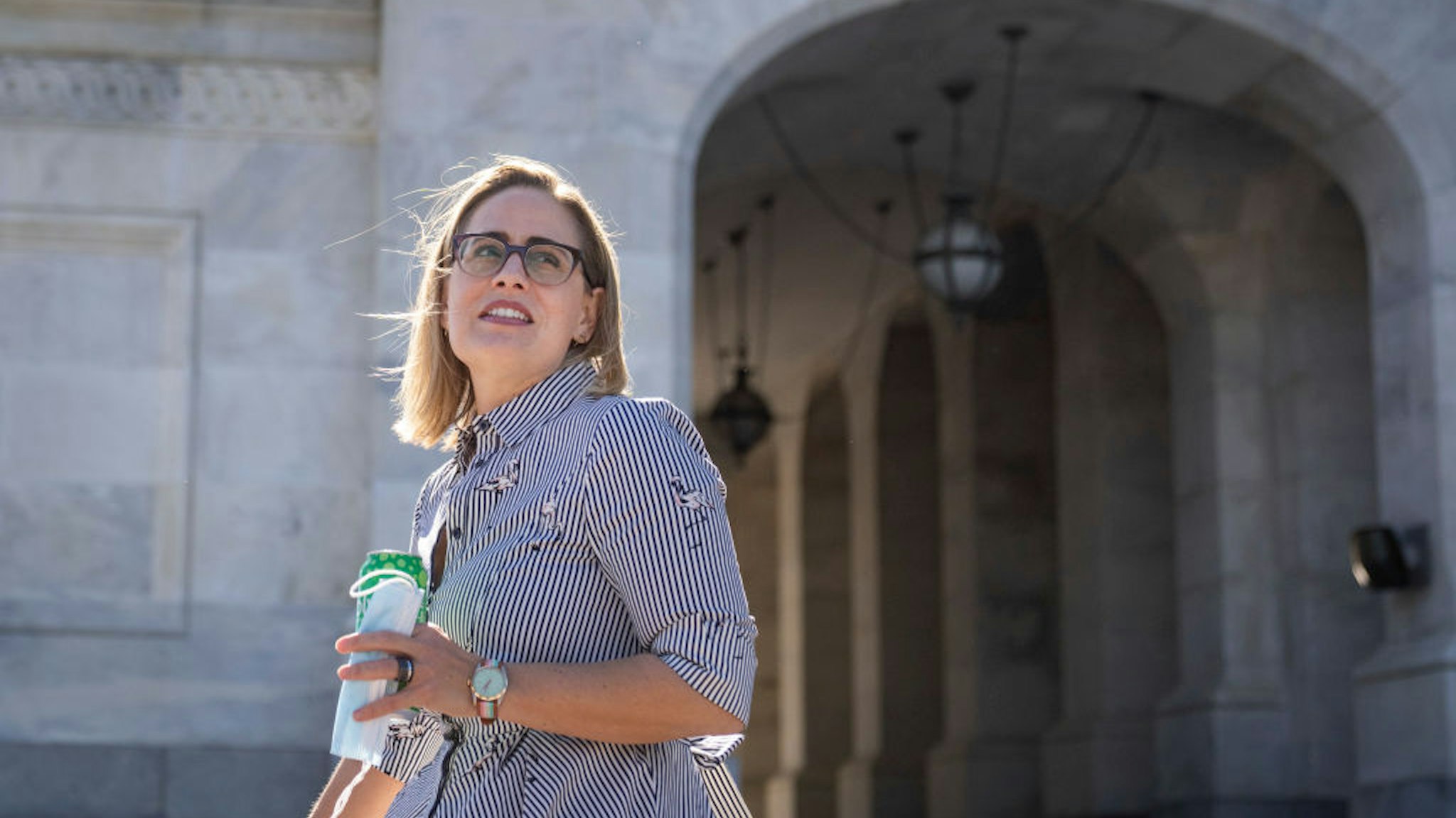 WASHINGTON, DC - OCTOBER 27: Sen. Kyrsten Sinema (D-AZ) leaves the U.S. Capitol after a private meeting and a vote October 27, 2021 in Washington, DC. Democrats are continuing internal negotiations about the Biden administration's social policy spending bill. (Photo by Drew Angerer/Getty Images)