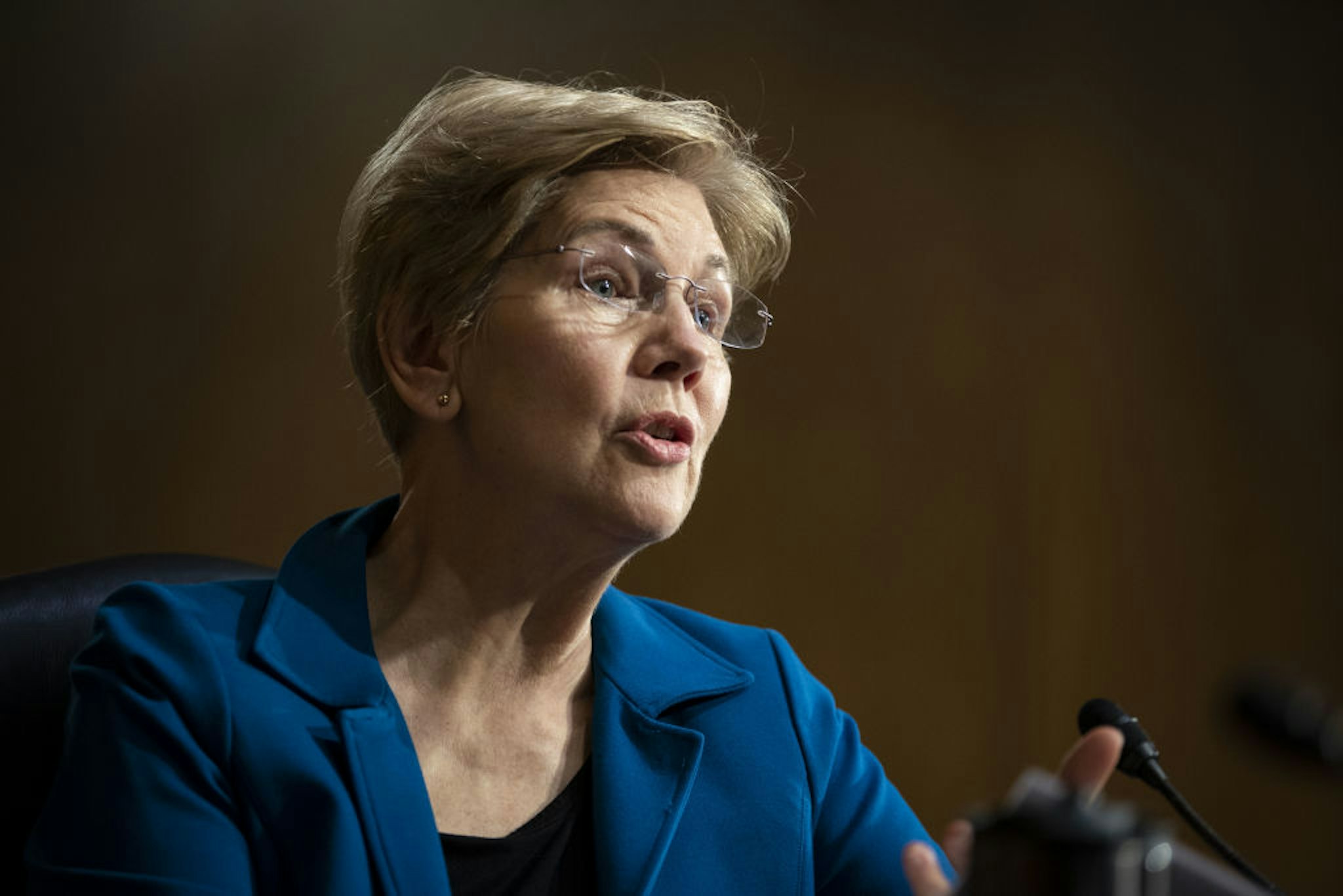 Senator Elizabeth Warren, a Democrat from Massachusetts, questions Lael Brainard, governor of the U.S. Federal Reserve, not pictured, during a Senate Banking, Housing, and Urban Affairs Committee confirmation hearing in Washington, D.C., U.S., on Thursday, Jan. 13, 2022. Brainard, nominated by President Biden to serve as Fed vice chair, said tackling inflation and getting it back down to 2% while sustaining an inclusive recovery is the U.S. central bank's most pressing task. Photographer: Al Drago/Bloomberg via Getty Images