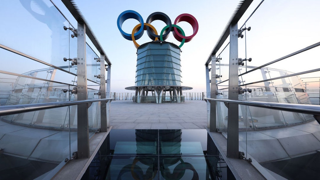 BEIJING, CHINA - JANUARY 16: Visitors pose for photographs with the Olympic rings at the Beijing Olympic Tower on January 16, 2022 in Beijing, China. The Beijing 2022 Winter Olympics are set to open February 4th. (Photo by Lintao Zhang/Getty Images)