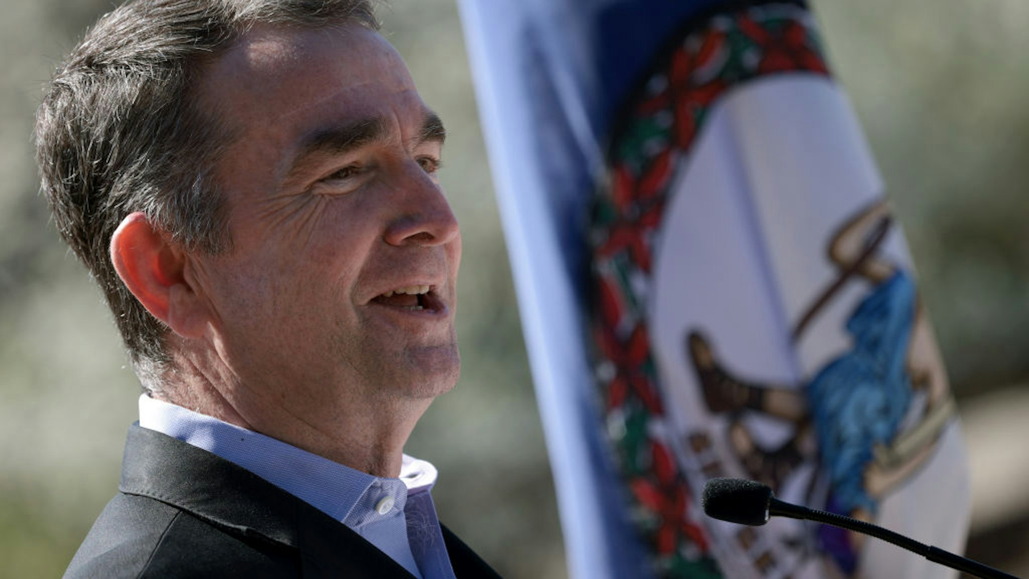 ALEXANDRIA, VIRGINIA - MARCH 30: Virginia Gov. Ralph Northam speaks at an event titled “Transforming Rail in Virginia” at the Amtrak-VRE station in March 30, 2021 in Alexandria, Virginia. The Transforming Rail in Virginia program will cost about $3.7 billion and will double Amtrak service and double Virginia Railway Express (VRE) service along the I-95 corridor, as well as work toward the separation of freight and passenger lines. (Photo by Win McNamee/Getty Images)