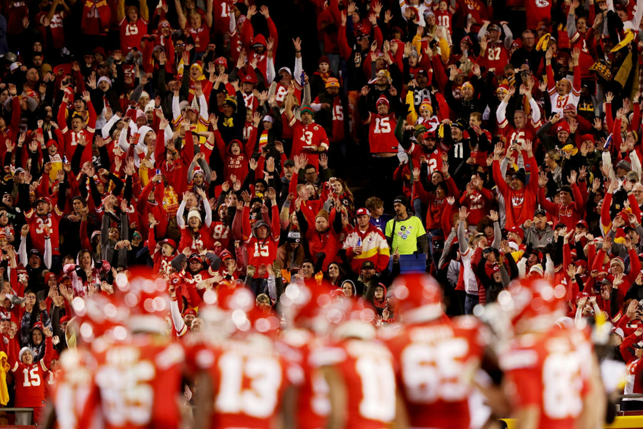 KANSAS CITY, MISSOURI - DECEMBER 26: Kansas City Chiefs fans do the wave during the third quarter in the game against the Pittsburgh Steelers at Arrowhead Stadium on December 26, 2021 in Kansas City, Missouri. (Photo by Jamie Squire/Getty Images)