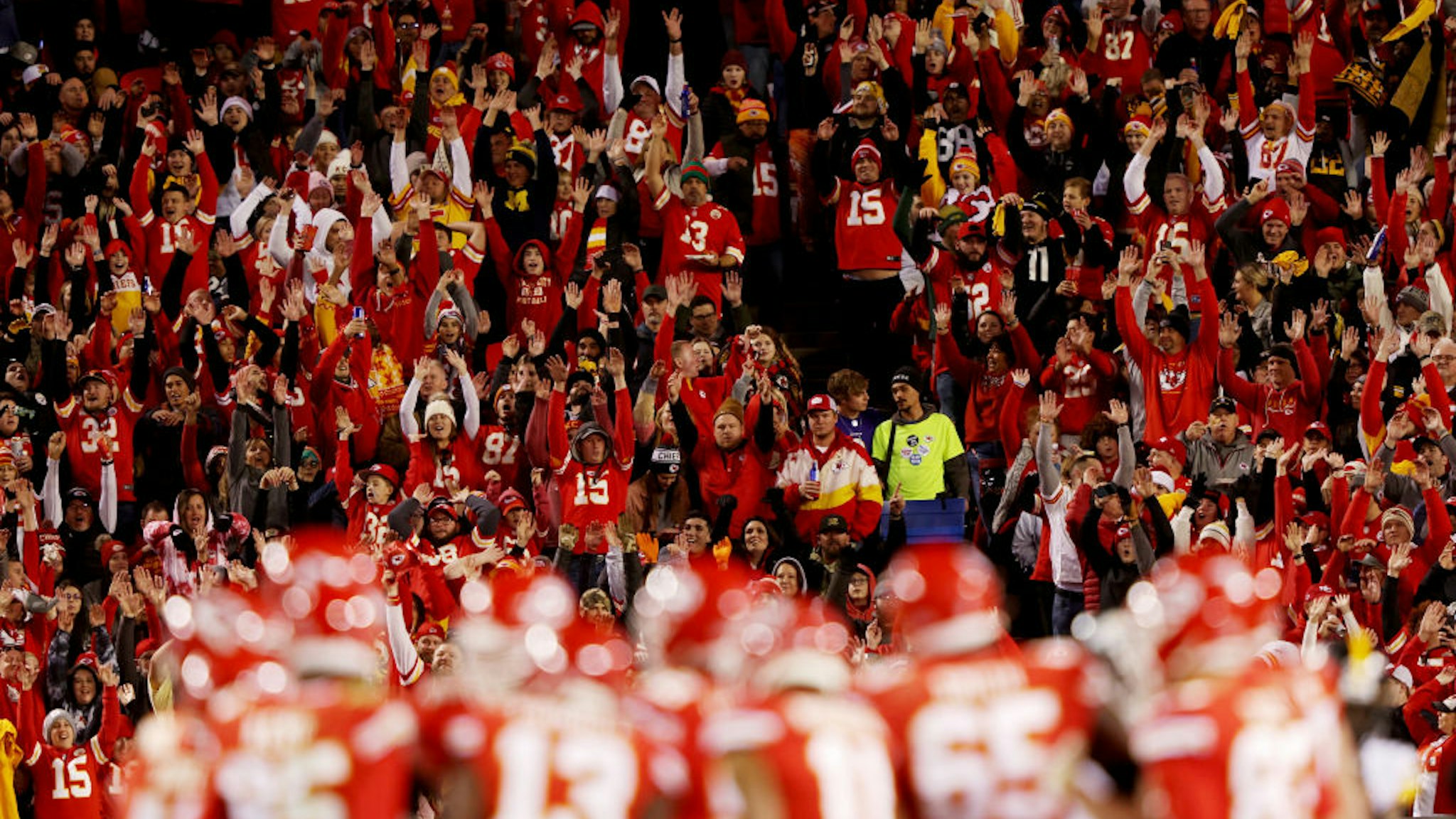 KANSAS CITY, MISSOURI - DECEMBER 26: Kansas City Chiefs fans do the wave during the third quarter in the game against the Pittsburgh Steelers at Arrowhead Stadium on December 26, 2021 in Kansas City, Missouri. (Photo by Jamie Squire/Getty Images)