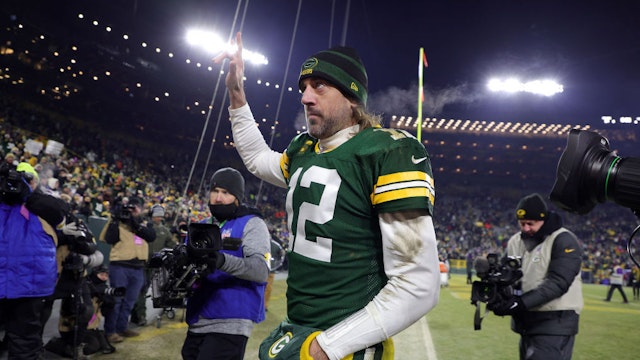 GREEN BAY, WISCONSIN - JANUARY 02: Quarterback Aaron Rodgers #12 of the Green Bay Packers walks off the field after the Packers defeated the Minnesota Vikings 37-10 to win the game at Lambeau Field on January 02, 2022 in Green Bay, Wisconsin. (Photo by Stacy Revere/Getty Images)