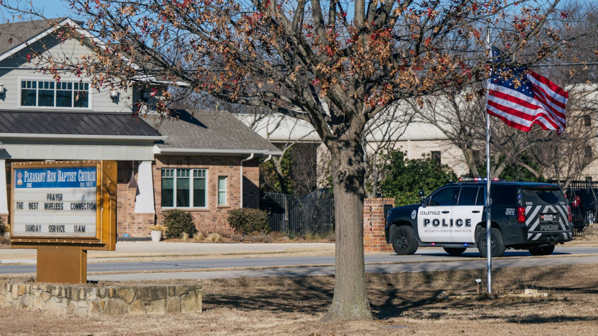 A law enforcement vehicle sits near the Congregation Beth Israel synagogue on January 16, 2022 in Colleyville, Texas.