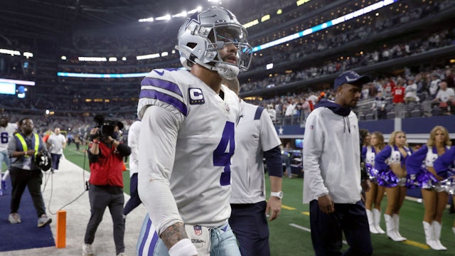 ARLINGTON, TEXAS - JANUARY 16: Dak Prescott #4 of the Dallas Cowboys walks off the field after losing to the San Francisco 49ers 23-17 in the NFC Wild Card Playoff game at AT&amp;T Stadium on January 16, 2022 in Arlington, Texas. (Photo by Tom Pennington/Getty Images)