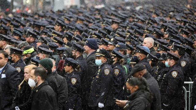 Thousands of police officers from around the country gather at St. Patrick's Cathedral to attend the funeral for fallen NYPD Officer Jason Rivera on January 28, 2022 in New York City.