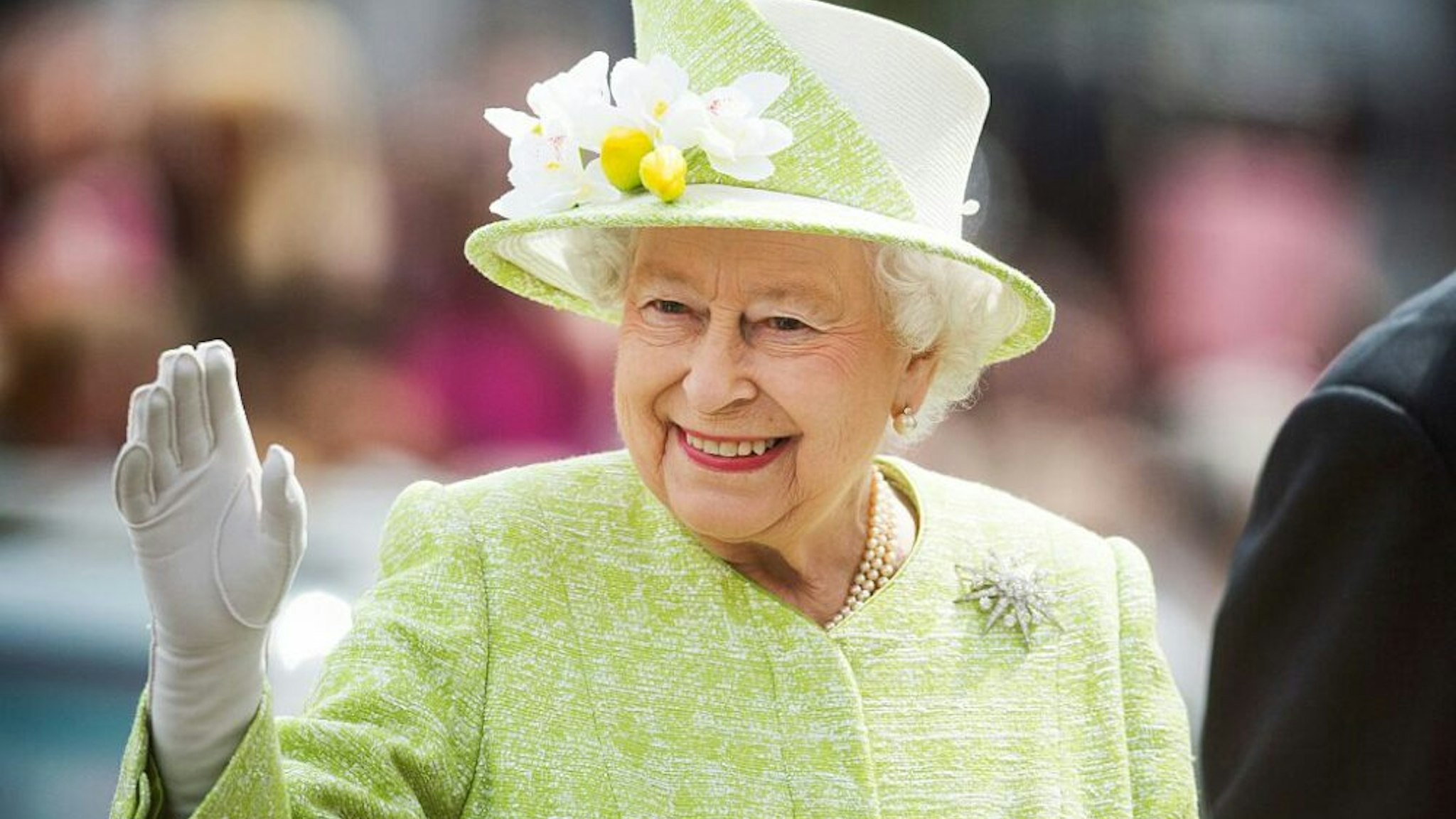 WINDSOR, ENGLAND - APRIL 21: Queen Elizabeth II waves during a walk about around Windsor on her 90th Birthday on April 21, 2016 in Windsor, England.