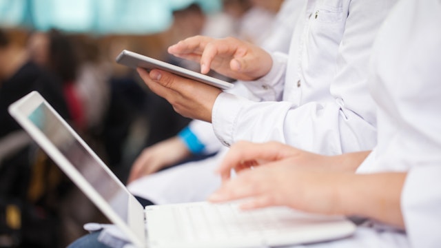 Healthcare Professionals Using Electronic Gadgets - stock photo