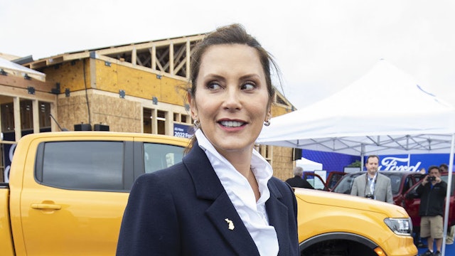 PONTIAC, MI - SEPTEMBER 21:Michigan Governor Gretchen Whitmer tours the 2021 Motor Bella auto show on September 21, 2021 in Pontiac, Michigan. The outdoor show runs from September 21 to September 26 and features over 350 cars, trucks, and utility vehicles on display, ride-along opportunities with professional drivers on a “hot laps track”, test drives, off-road track activations, and unique technology displays. (Photo by Bill Pugliano/Getty Images)