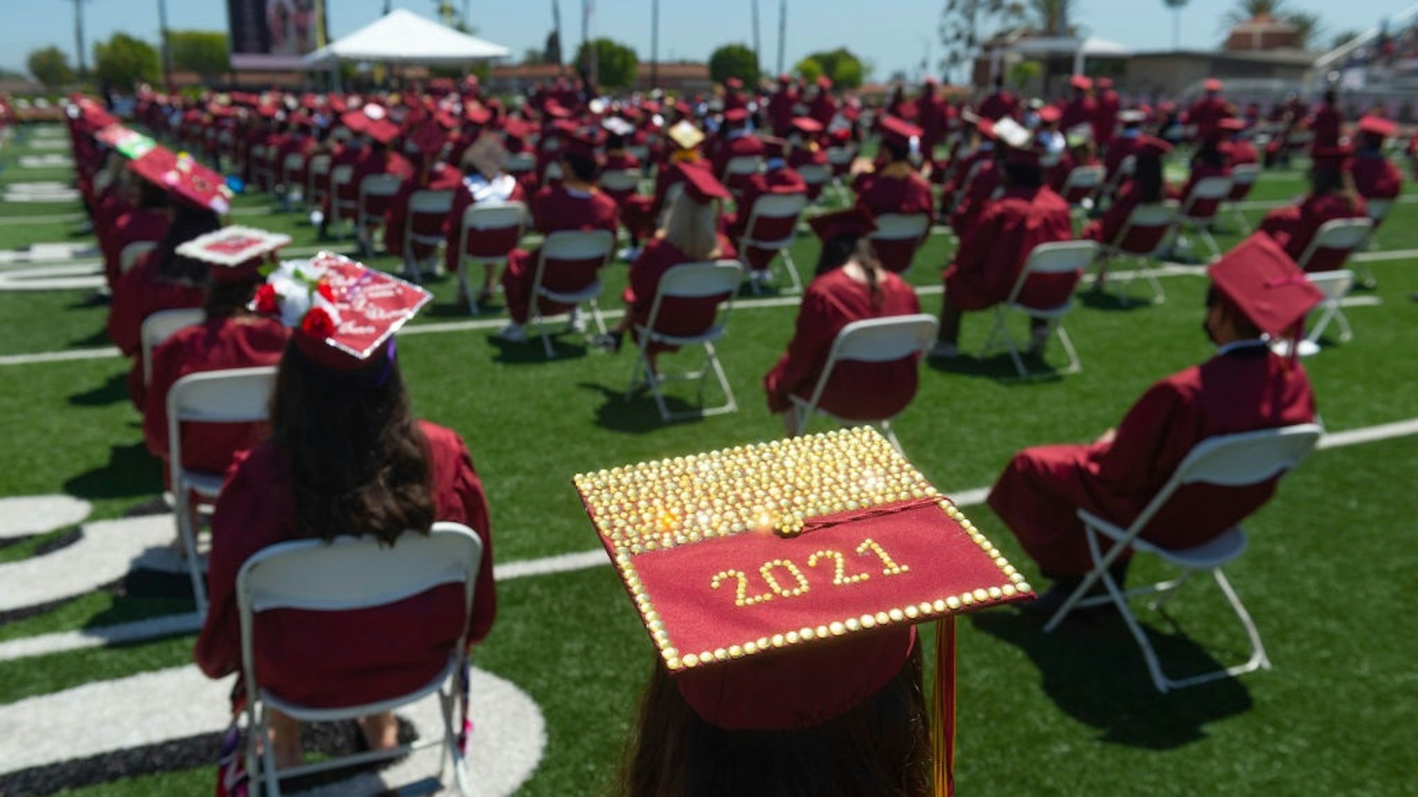 ORANGE, CA - JUNE 10: A graduate wears a decorated 2021 cap during commencement for El Modena High School at Fred Kelly Stadium in Orange, CA on Thursday, June 10, 2021.