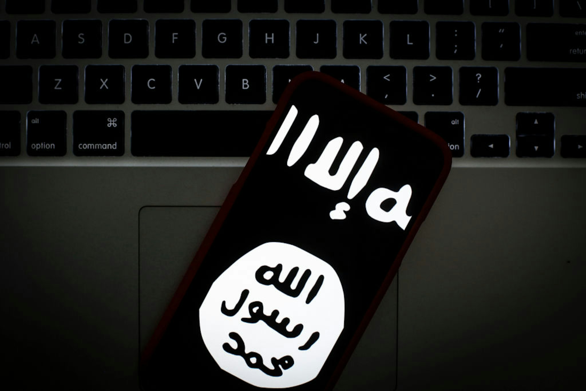 The Islamic State logo is seen on a portable mobile device in this photo illustration on January 22, 2019.