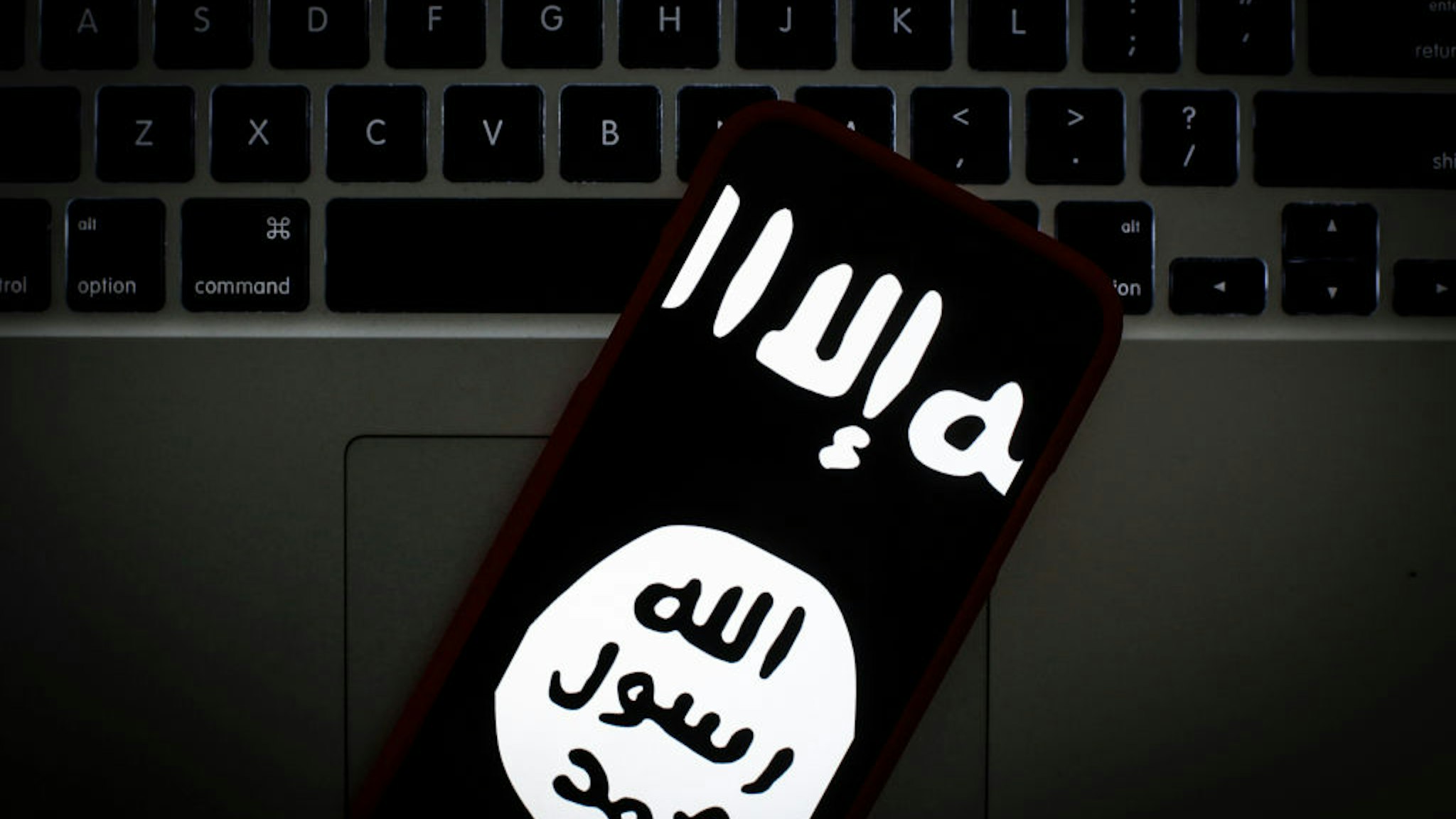 The Islamic State logo is seen on a portable mobile device in this photo illustration on January 22, 2019.