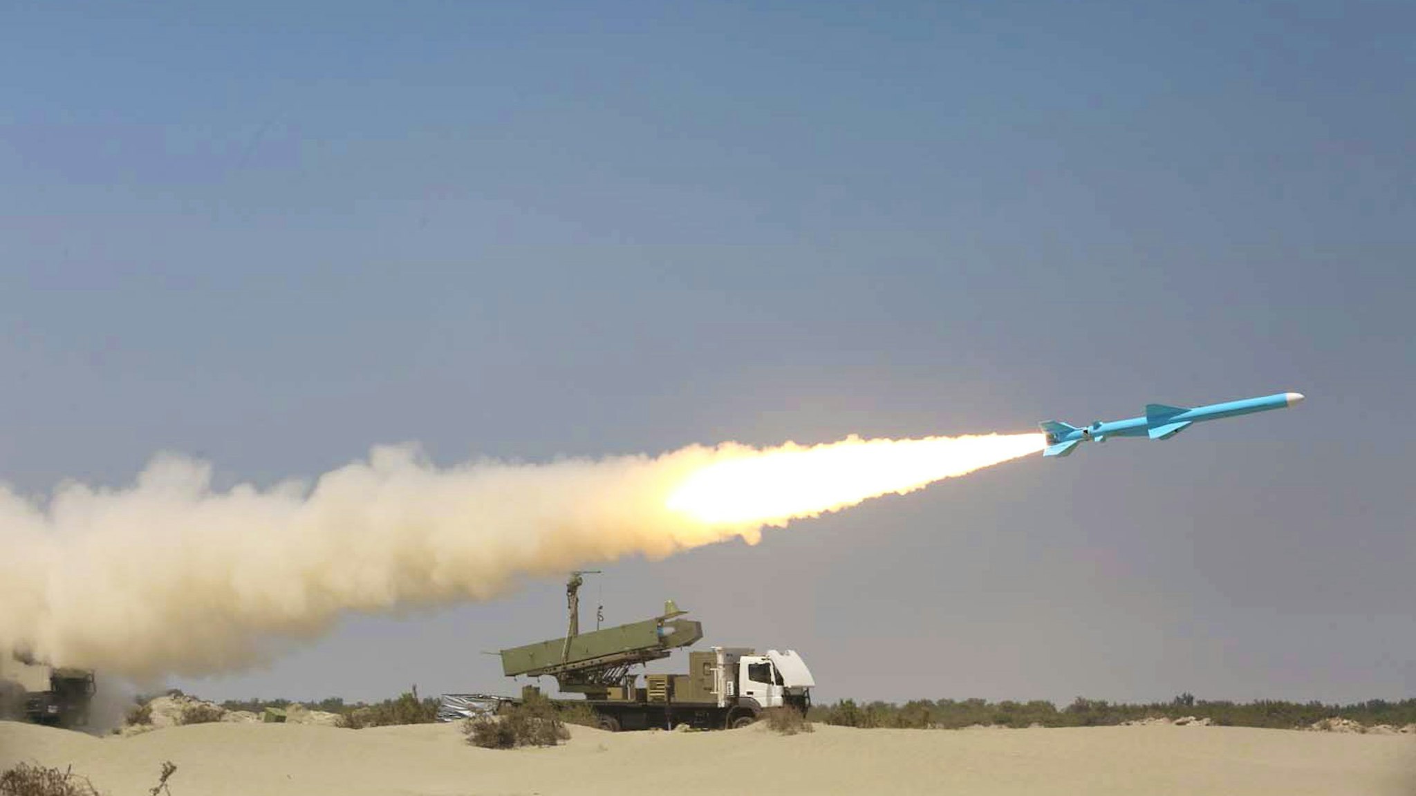 A handout picture provided by the Iranian Army's official website on September 11, 2020, shows an Iranian Ghader missile being fired during the second day of a military exercise in the Gulf, near the strategic strait of Hormuz in southern Iran. - The Iranian navy began on September 10 a three-day exercise in the Sea of Oman near the strategic Strait of Hormuz, deploying an array of warships, drones and missiles. One of the exercise's objectives is to devise "tactical offensive and defensive strategies for safeguarding the country's territorial waters and shipping lanes," the military said on its website.