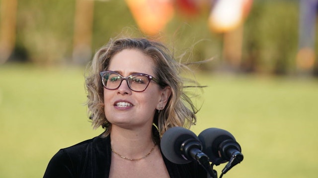 Senator Kyrsten Sinema, a Democrat from Arizona, speaks during an Infrastructure Investment and Jobs Act signing ceremony on the South Lawn of the White House in Washington, D.C., U.S., on Monday, Nov. 15, 2021. President Biden has said the $550 billion in fresh infrastructure spending he's signing into law will help ease inflation that's raising consumer alarm and weighing on his approval rating. Photographer: Stefani Reynolds/Bloomberg