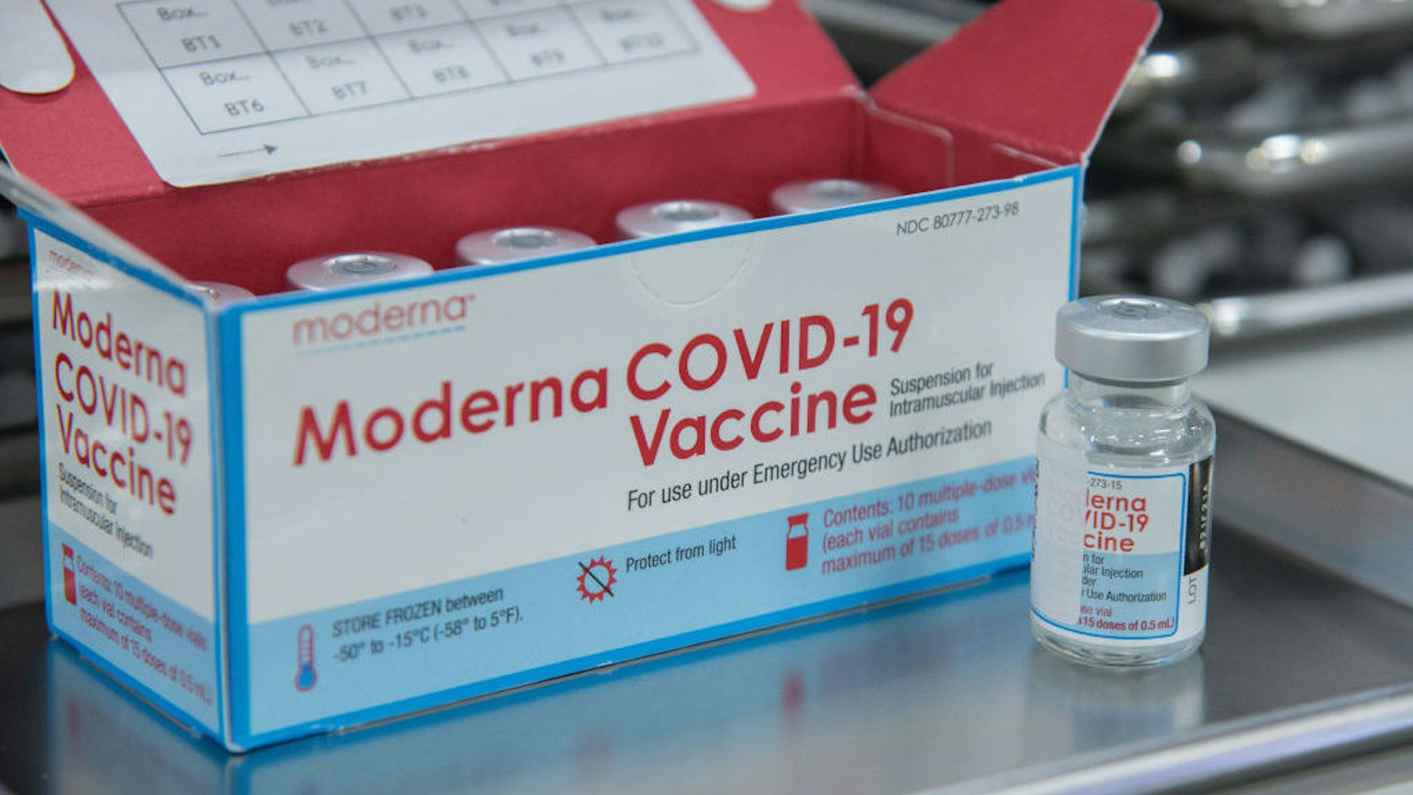 BANGKOK, THAILAND - 2022/01/05: An empty vial of the Moderna Covid-19 vaccine seen next to the box of Moderna Covid-19 vaccine doses during Covid-19 vaccination at the Bang Sue Grand Station in Bangkok. Thailand has accelerated Covid-19 vaccination shots and booster shots to contain the surge of COVID-19 coronavirus infections linked with the Omicron variant after the New Year holiday. Thailand's Ministry of Health reported that more than 2,338 cases of Omicron had been discovered in Thailand. (Photo by Peerapon Boonyakiat/SOPA Images/LightRocket via Getty Images)