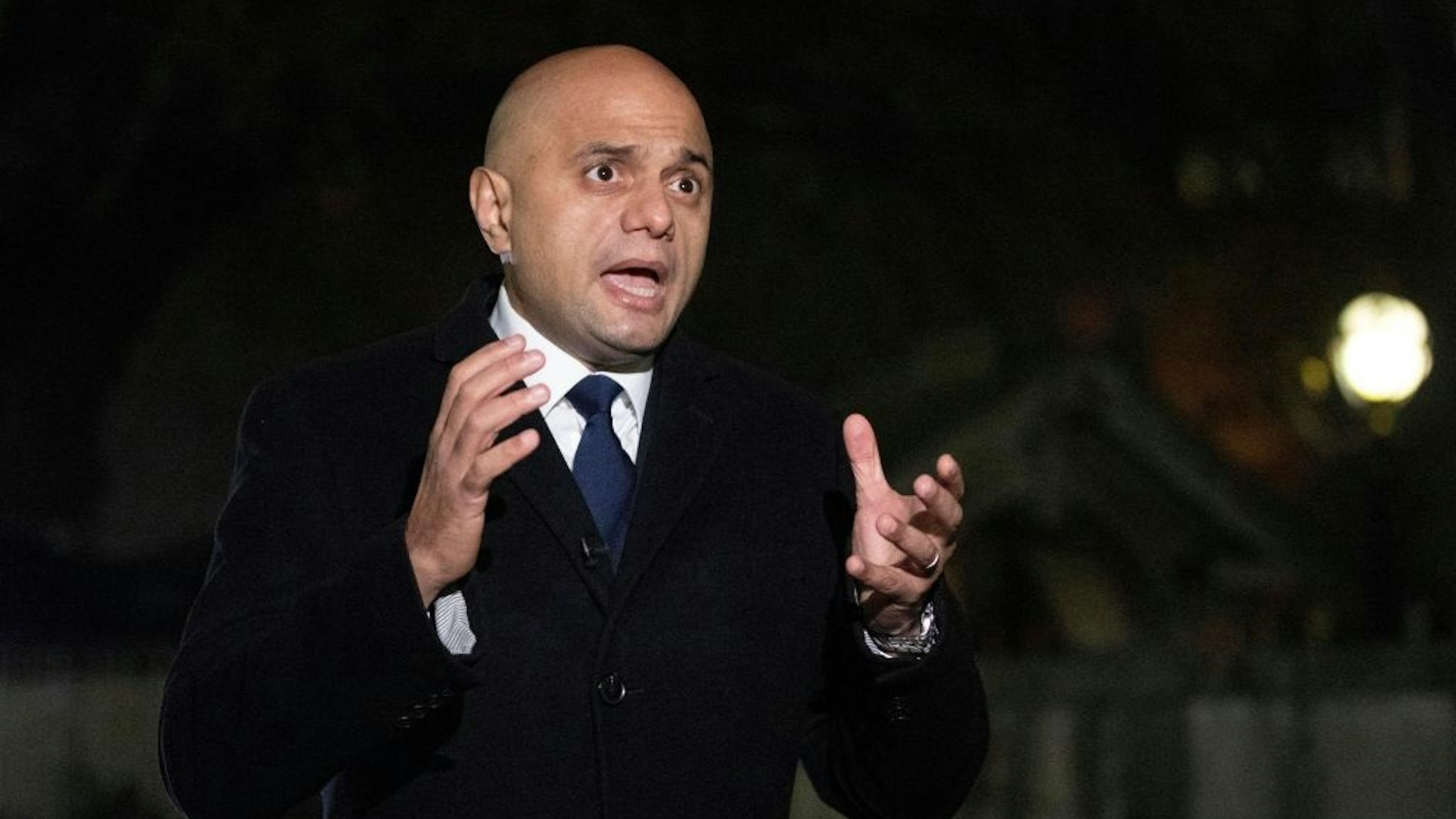 Britain's Health Secretary Sajid Javid speaks to members of the media during his visit to a Covid-19 vaccination centre at Guy's and St Thomas' Hospital in central London on November 29, 2021.