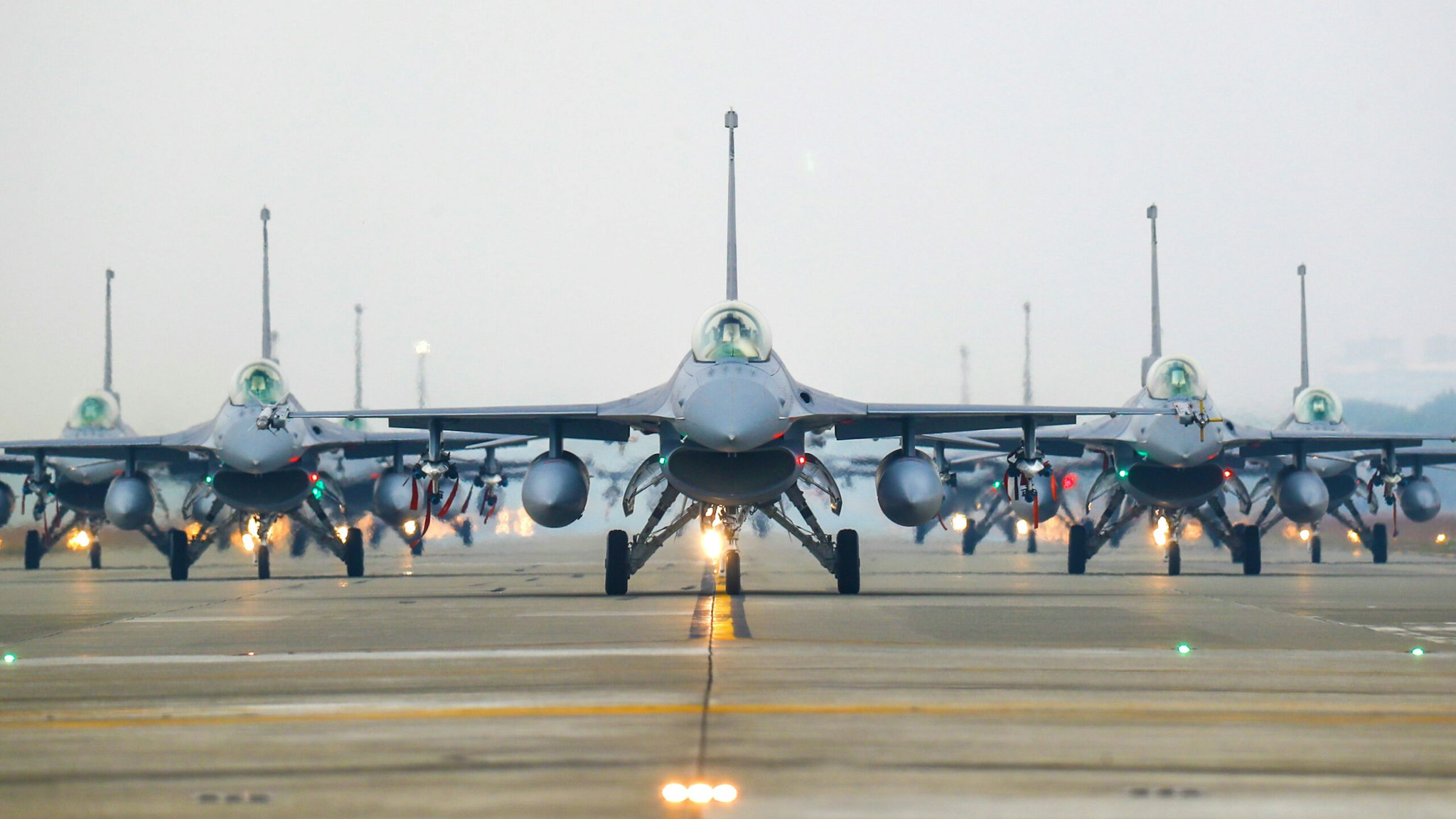 F-16V jet fighters taxi on the runway at the Air Force base, as the Taiwanese military holds a drill for preparedness enhancement ahead of the Chinese New Year, amid rising threats from China, in Chiayi, Taiwan, on Jan 5, 2022. Taiwan has been facing intensifying threats from Beijing including a record breaking number of PLA warplanes flying into its ADIZ, while the US has been approving more arms sales to Taipei.