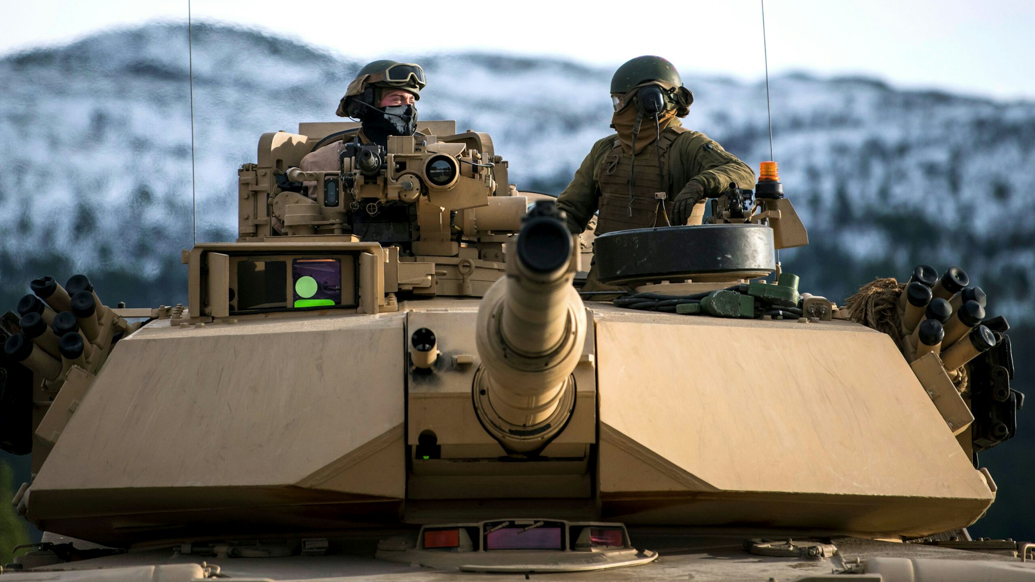 US Marines drive an M1 Abrams to take part in an exercise to capture an airfield as part of the Trident Juncture 2018, a NATO-led military exercise, on November 1, 2018 near the town of Oppdal, Norway. - Trident Juncture 2018, is a NATO-led military exercise held in Norway from 25 October to 7 November 2018. The exercise is the largest of its kind in Norway since the 1980s. Around 50,000 participants from NATO and partner countries, some 250 aircraft, 65 ships and up to 10,000 vehicles take part in the exercise. The main goal of Trident Juncture is allegedly to train the NATO Response Force and to test the alliance's defence capability.