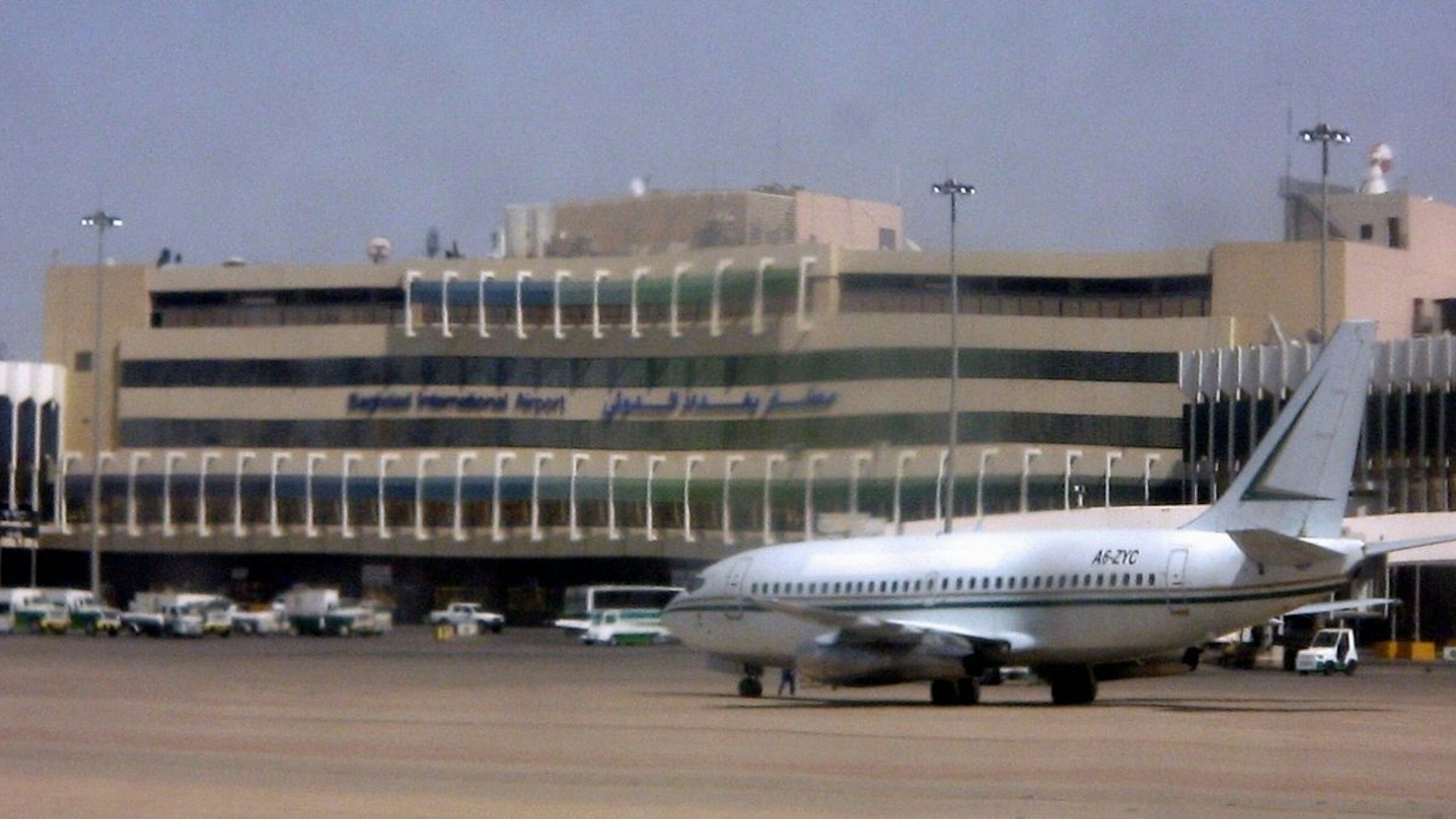 An unidentified plane sits on the runway of the Baghdad international airport 06 July 2006. Formerly known as Saddam International Airport, the French-designed Baghdad airport was severely damaged during the 2003 war, and was already in a state of disrepair as a result of UN-imposed sanctions.