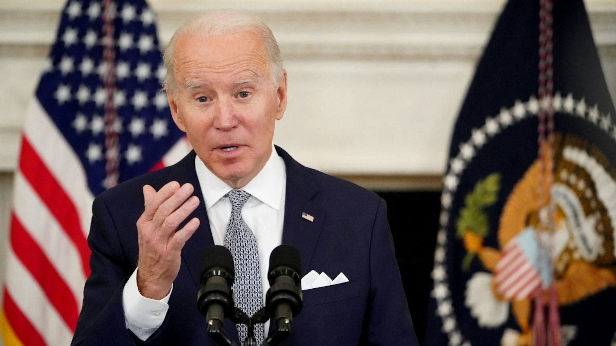 US President Joe Biden speaks about the December jobs report on January 7, 2022, from the State Dining Room of the White House in Washington, DC.