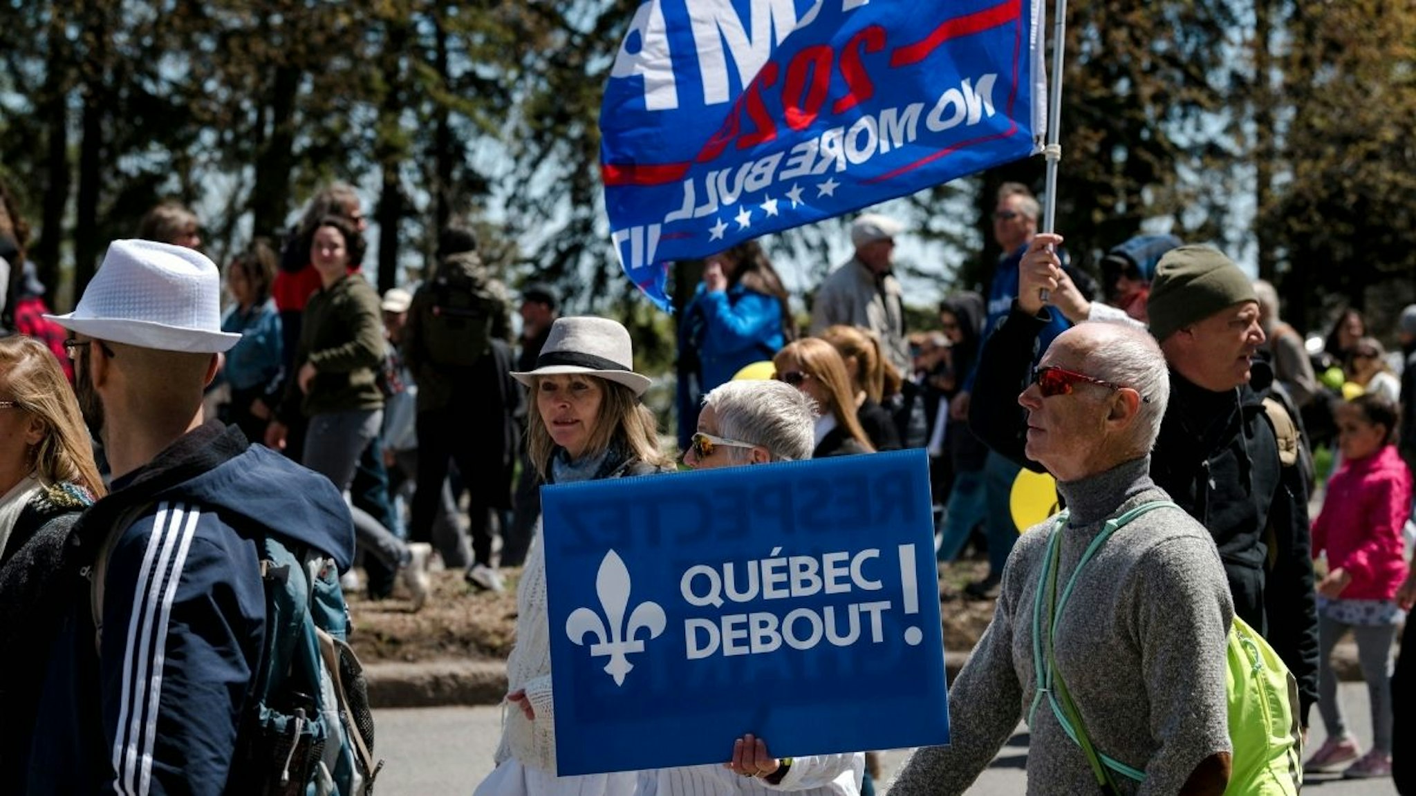Demonstrators march against new Covid-19 anti-mask and anti-curfew restrictions, in Montreal on May 1, 2021.