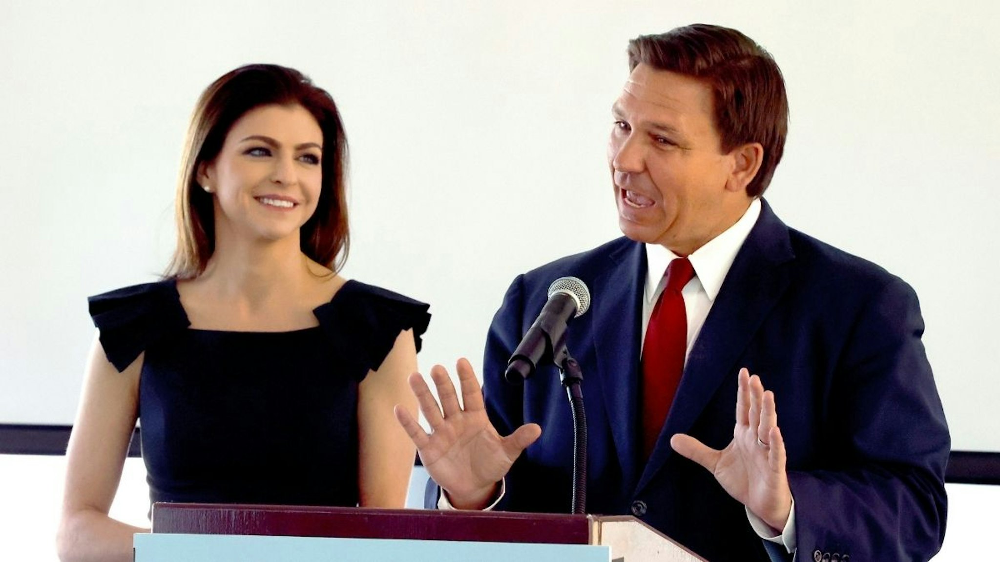 Florida Gov. Ron DeSantis introduces Florida first lady Casey DeSantis during a news conference announcing the Resiliency Florida initiative, at the Amway Center in Orlando, Friday, Feb. 26, 2021.